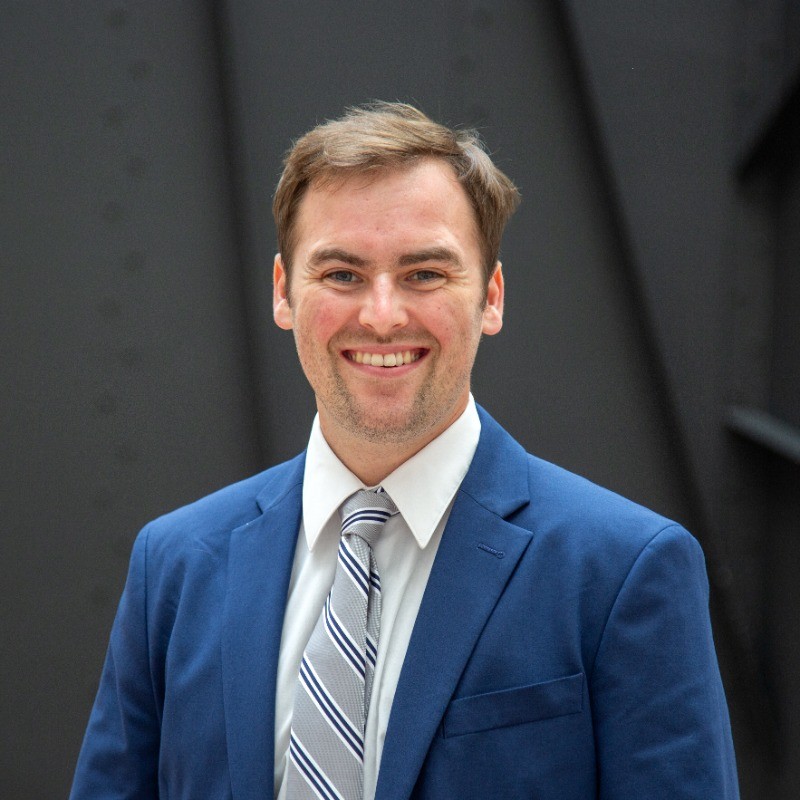 portrait of Michael Redmond in blue suit