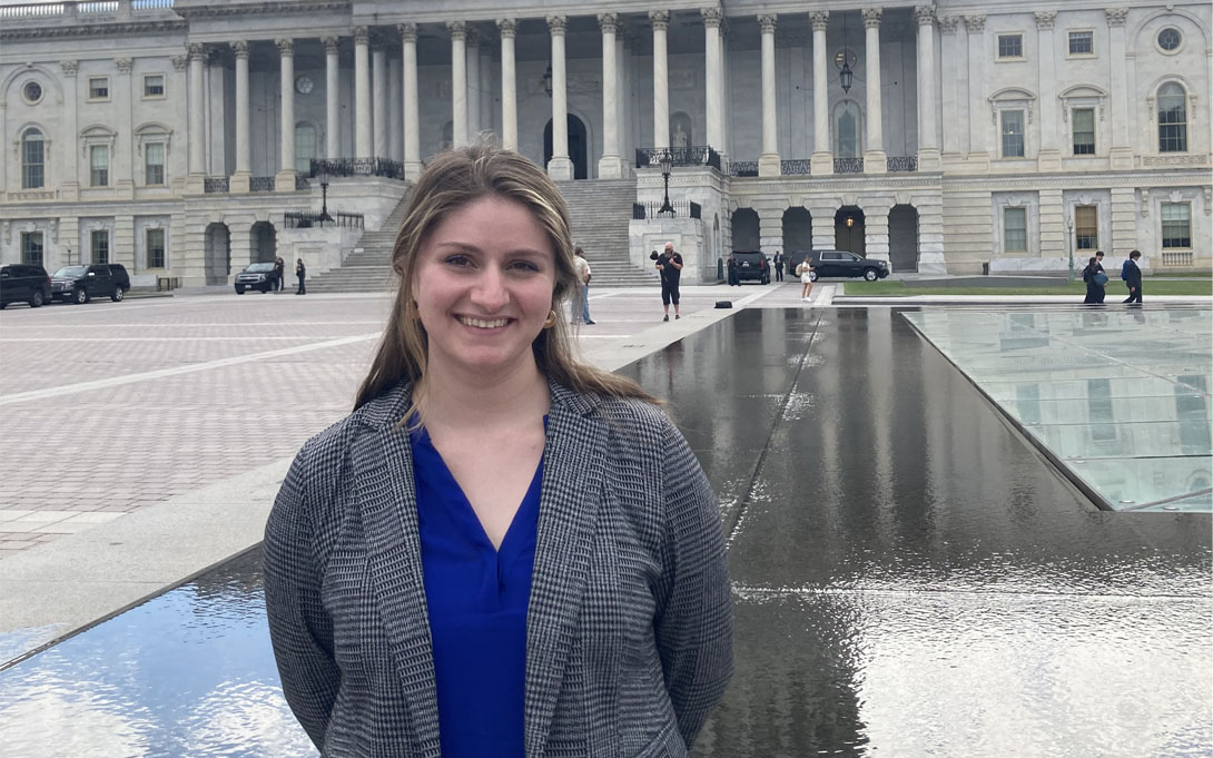 Photo of Emily Kosta in front of capital building in Washington, DC