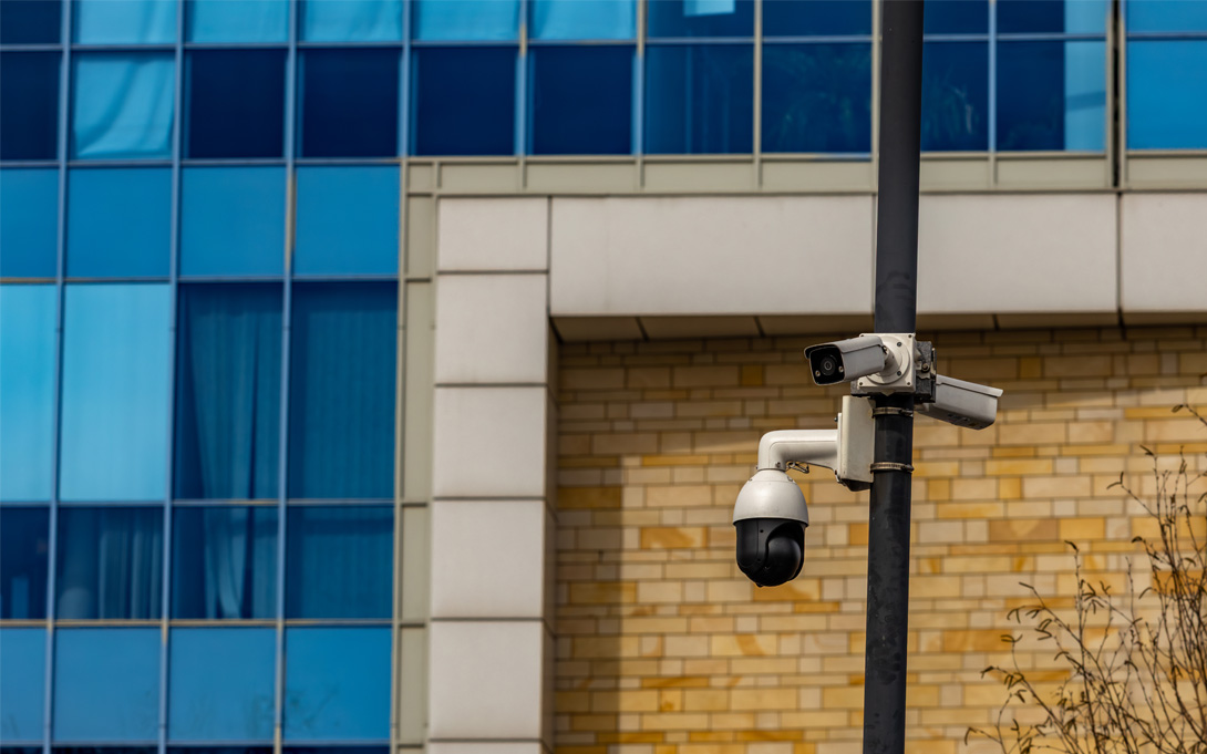 image of a surveillance camera on a traffic light post