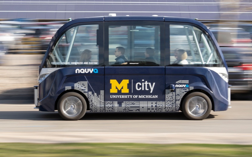Photo of the MCity driverless shuttle on carrying passengers on a public road (Photo courtesy of MCity)