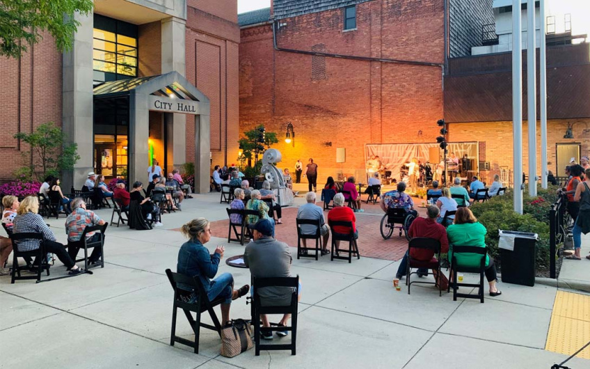 Photo of people sitting outside Michigan Municipal League