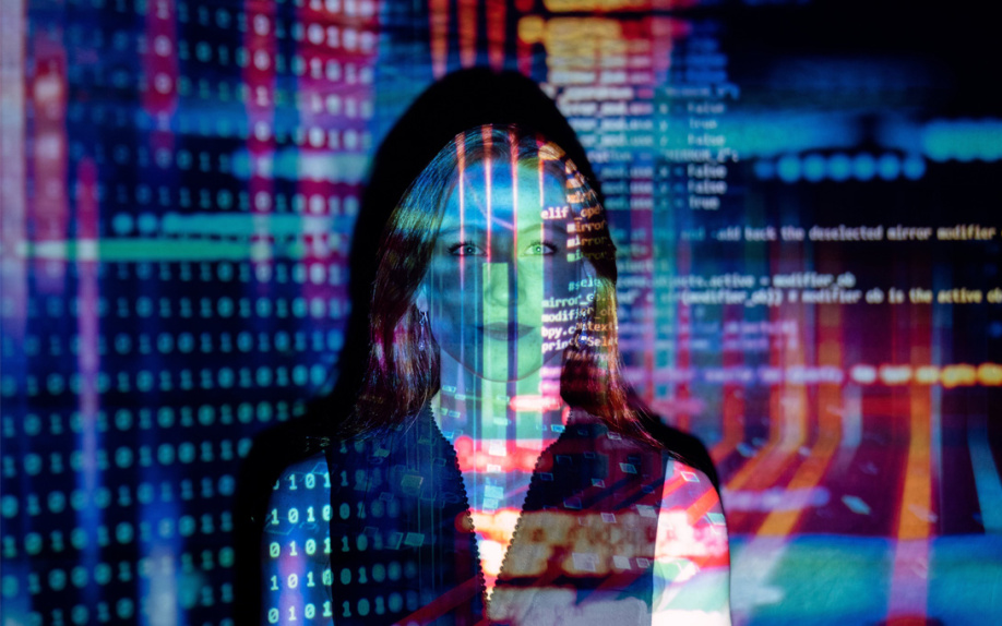 Photo of woman with code and binary overlayed